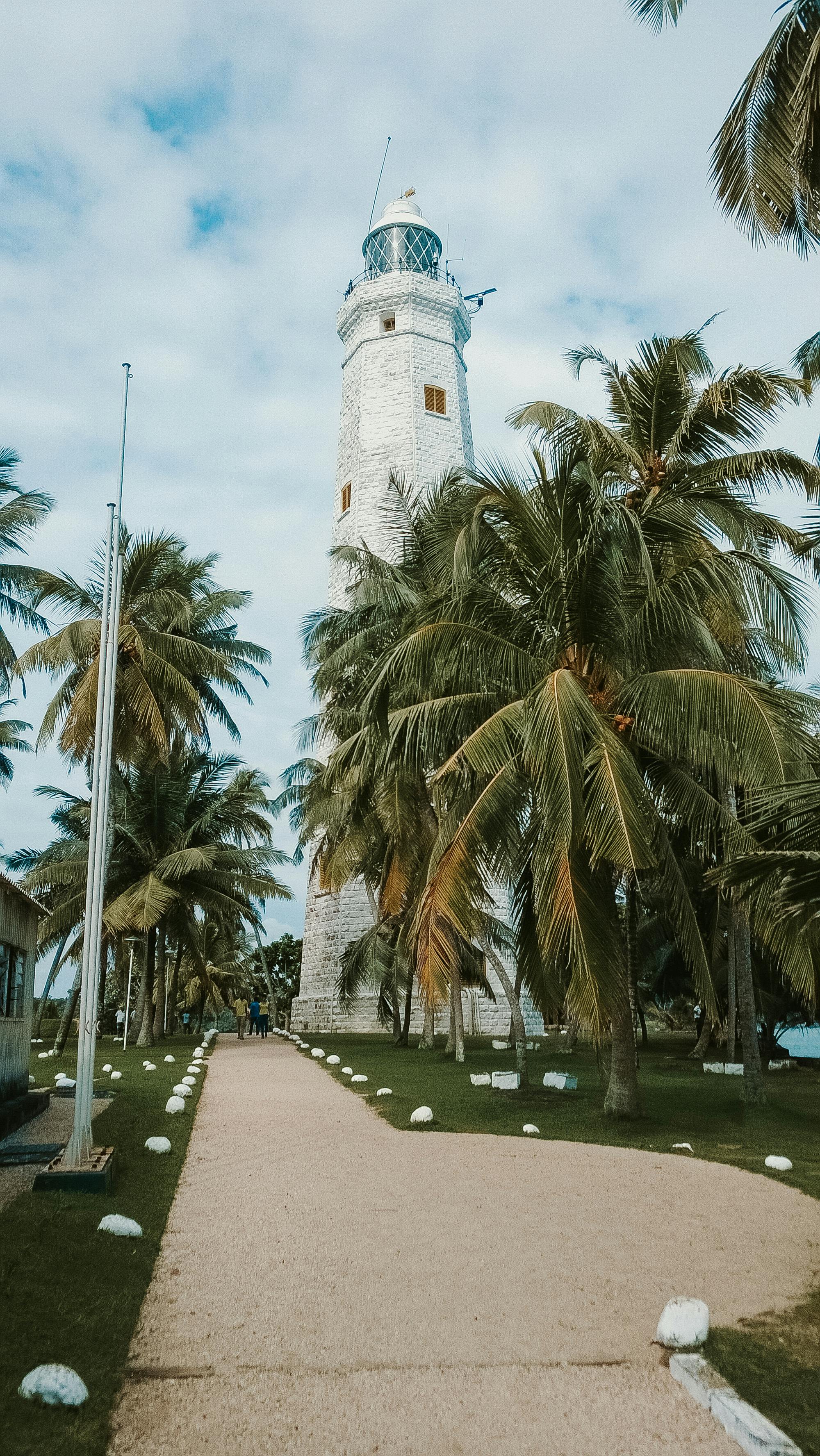 Dondra Head Lighthouse against a stormy sky